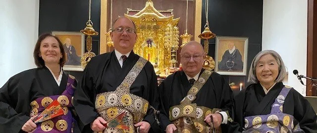 Ministers of the New York Buddhist Church in formal robes before the altar