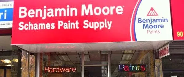 The M. Schames & Son storefront on Delancey Street, under a red Benjamin Moore awning, windows lettered Hardware and Paints